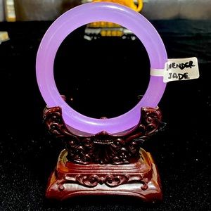 Full moon Lavender Jade Bangle with display stand.
